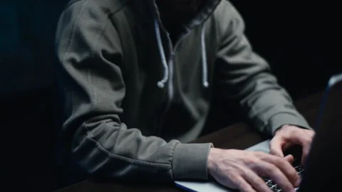 Tilt down shot of hacker man hacking online web site or hacking into security Video stock 145121615