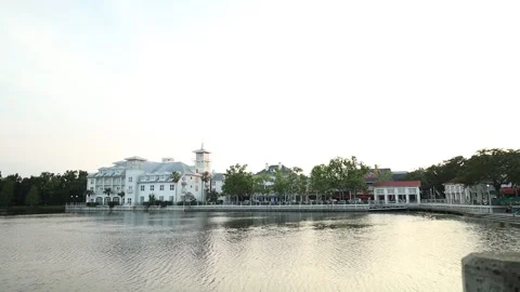 Tilt down shot of lake side park during golden Hour Video stock 245452855