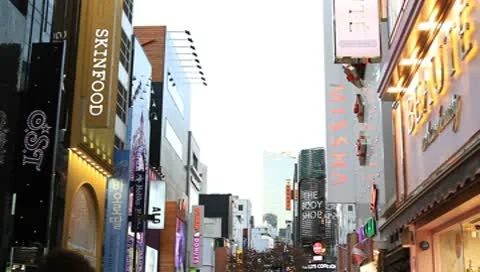 Tilt-down shot of Large crowd on downtown street Stock Footage 8984706