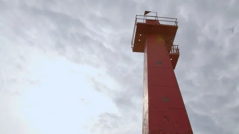 Tilt down shot of the lighthouse at Pere Marquette, Michigan. 4k60p Stock Footage 128859140