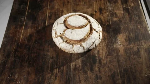 Tilt down shot of loaf of bread with number 9 on it Stock Footage 153058793