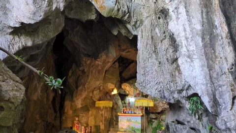 Tilt down shot of Marble Mountains cave in Da Nang Vietnam Stock Footage 313486691
