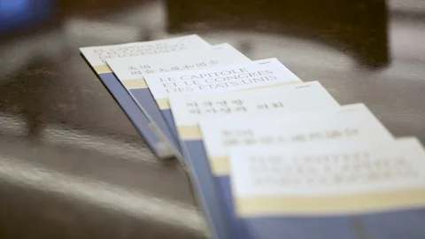 Tilt down shot of pamphlets for Capitol Hill, Washington D.C. Stock Footage 130020978