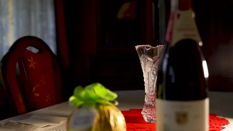 Tilt down shot of a red wine with Ferrero Rocher Stock Footage 218402722