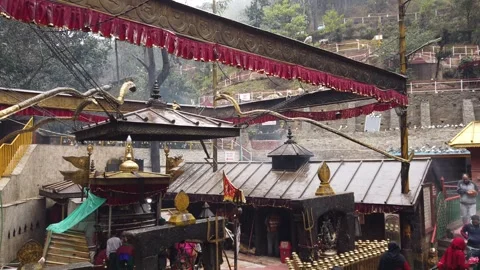 Tilt Down Shot of Sacrificial Shrine in Raining Kathmandu Stock-Footage 250105949
