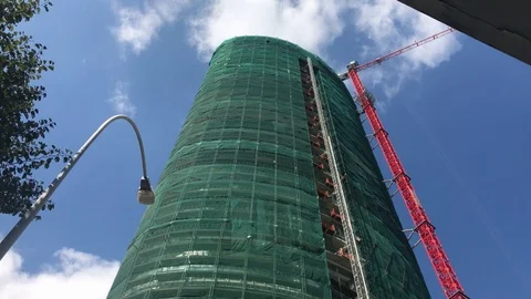Tilt Down Shot of Skyscraper Construction Site in Urban European City Stock Footage 103100239