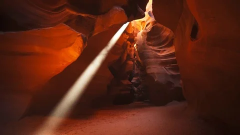 Tilt down shot of a sun beam in upper antelope canyon, az Stock Footage 75697371