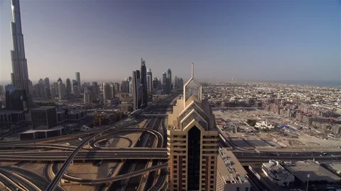 Tilt down from sky to Dubai skyline Stock Footage 104398357