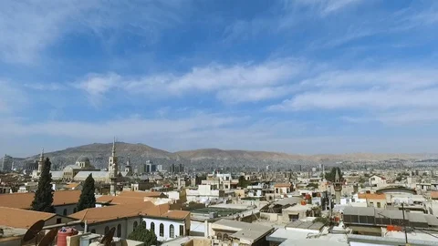 Tilt down from sky to Umayyad Mosque with Damascus' skyline, Syria Stock Footage 119650984