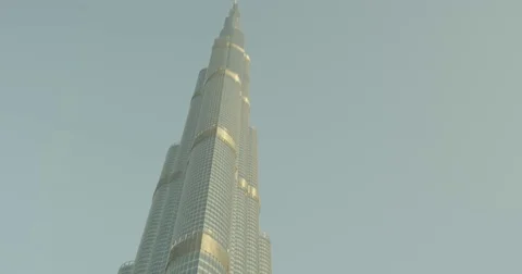 Tilt down from a skyscraper to a rich man in a limo pointing to pullover Stock Footage 73253928