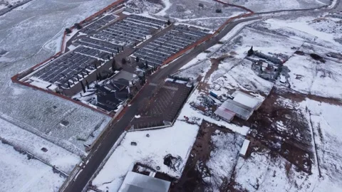 Tilt down to snow over graveyard Stock Footage 158547643