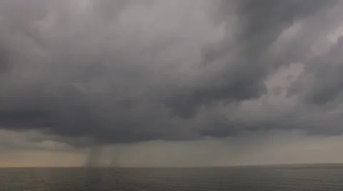 Tilt Down from Storm Clouds to Ship on Sea Stock Footage 51445667