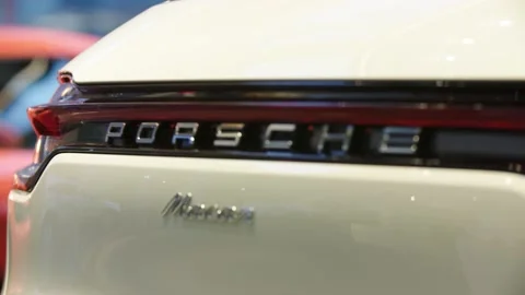 Tilt down of tail light and logo, white porsche macan Stock Footage 229808957