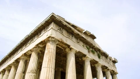 Tilt down tracking shot camera moves forward length of Temple of Hephaestus Stock Footage 92439665