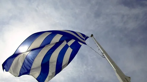 Tilt down tracking shot from Greece flag to the parthenon acropolis visitors Stock Footage 92438055