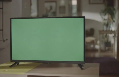 Tilt Down TV Green Screen in Living Room Handheld no Color Grading Stock Footage 170081871