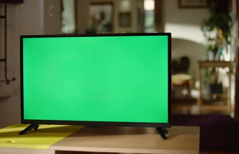 Tilt Down TV Green Screen in Living Room Handheld Color Graded Stock Footage 170081886