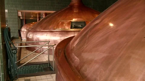Tilt Down to Two Large Copper Beer Kettles Vídeos de archivo 43782614
