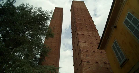 Tilt Down of Two Medieval Watchtowers in Pavia, Italyl Stock Footage 203549987