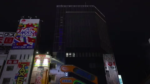 Tilt-down video of video game arcades SEGA Akihabara 2nd building in Tokyo. Stock Footage 138323844