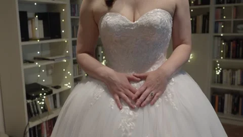 Tilt-Down View of Bride in White Lace Wedding Dress and Sweetheart Gown Stock Footage 342477783