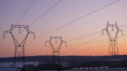 Tilt down view electric power lines in french countryside surrounded by natur Stock Footage 157007569