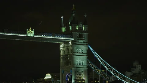 Tilt down view of Tower Bridge, in London, at night Stock Footage 217078228