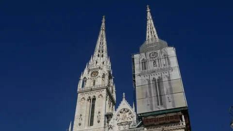 Tilt down Zagreb Cathedral from blue sky to the tourist visiting the church Stock Footage 89147904