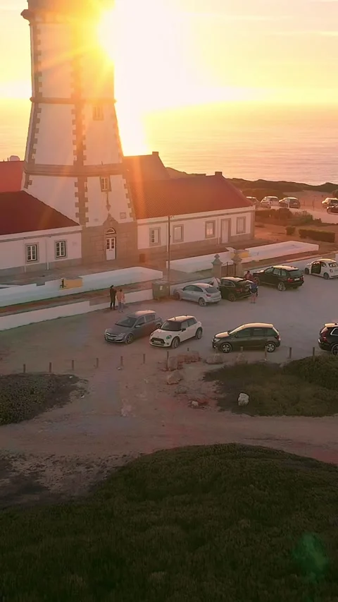 Tilt up drone shot of lighthouse, cape Espichel at sunset, Portugal Stock Footage 309025930