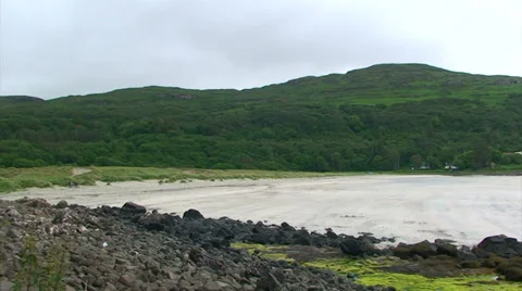 Tilt on empty beach on a cloudy summer day Stock Footage 39859326