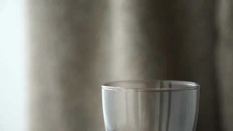 Tilt of an empty glass of wine Stock Footage 232400428