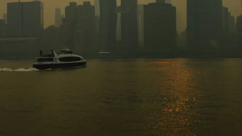 Tilt From Ferry On River To Heavily Diffused New York City Skyline Stock Footage 243704849