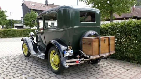 Tilt: Ford Model A, oldtimer, historic car with spare tire and wooden chest Stock Footage 114391314