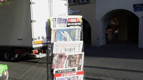 Tilt-up to French press reporting about Bataclan Terrorist attack in Paris Stock Footage 80622840