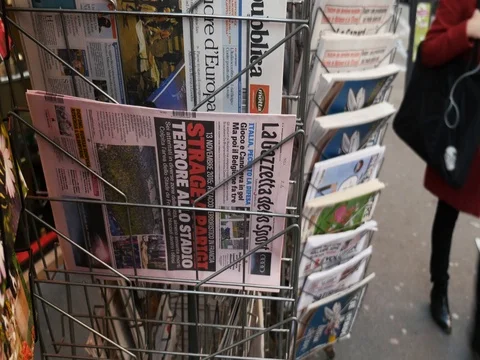 Tilt-up to French press reporting about Bataclan Terrorist attack in Paris Stock Footage 80623348