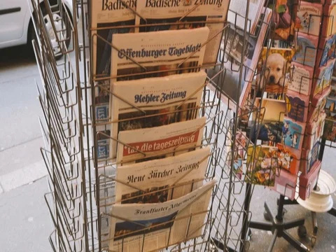Tilt-up to French press reporting about Bataclan Terrorist attack in Paris Stock Footage 80623613
