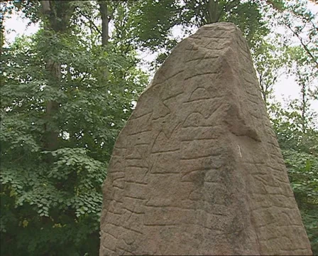 Tilt up front of the Glavendrup stone, an ancient rune stone with inscriptions Stock Footage 43404837