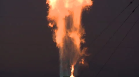 Tilt up on gas flare Stock Footage 47938751