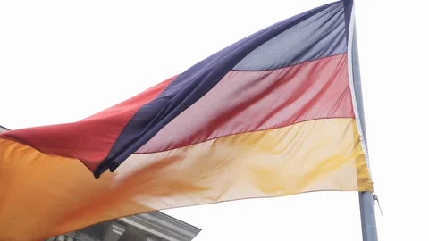Tilt up to German Flag waving during cloudy day in Berlin. Stock Footage 127338189