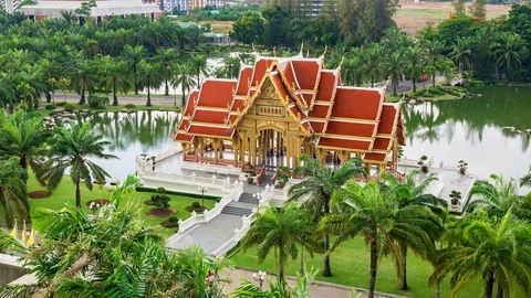 Tilt up high angle timelapse of Thai Pavilion on side of lake on rainy day Stock Footage 111166363
