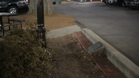 Tilt up of light pole in small town at night. Stock Footage 85801036