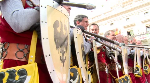 Tilt up on line of warriors with shields advancing little by little Stock Footage 47967737