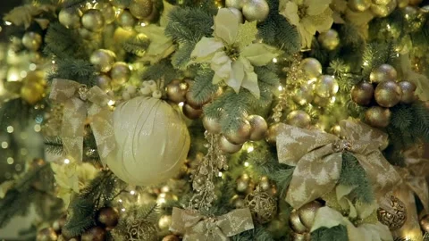 Tilt medium shot of christmas tree with golden bulb ornaments. Stock Footage 251529525