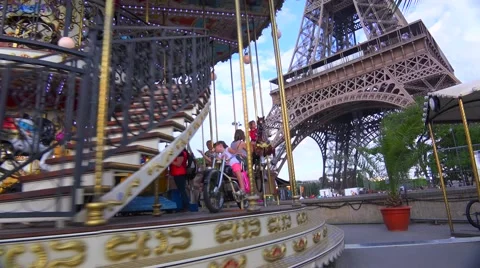 Tilt up from a Merry Go Round to the Eiffel Tower, Paris. Stock Footage 41581451