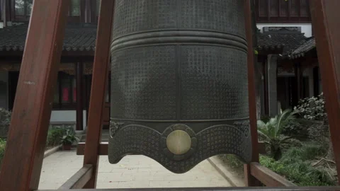 Tilt Up: Metallic bell with Chinese script at Buddhist temple - Suzhou, China Stock Footage 149663251