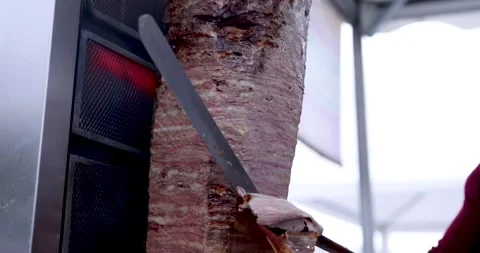 Tilt Motion While Cutting Cooked Doner with Doner Knife 4K Slow Motion 库存影片 246413888