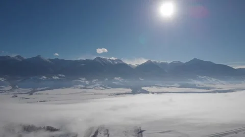 Tilt up to Mountain range in extreme cold Stock Footage 310526869