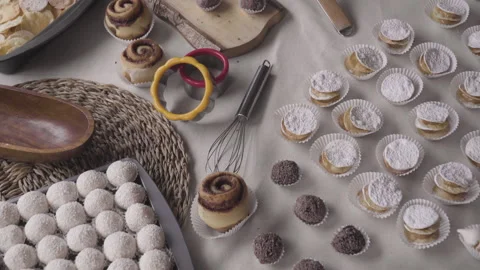 Tilt movement on the table with many sweets Stock Footage 240313011