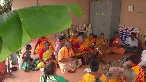 Tilt MS of people singing prayers in Tirupati, India Stock Footage 58766312