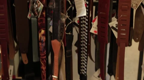 Tilt up multiple guitar straps Stock Footage 56036441